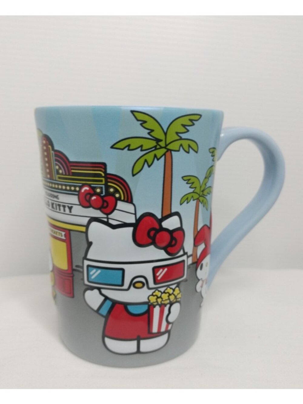 Universal Studios Coffee Mug Cup Starring Hello Kitty at the Movies w/Pikachu 3D